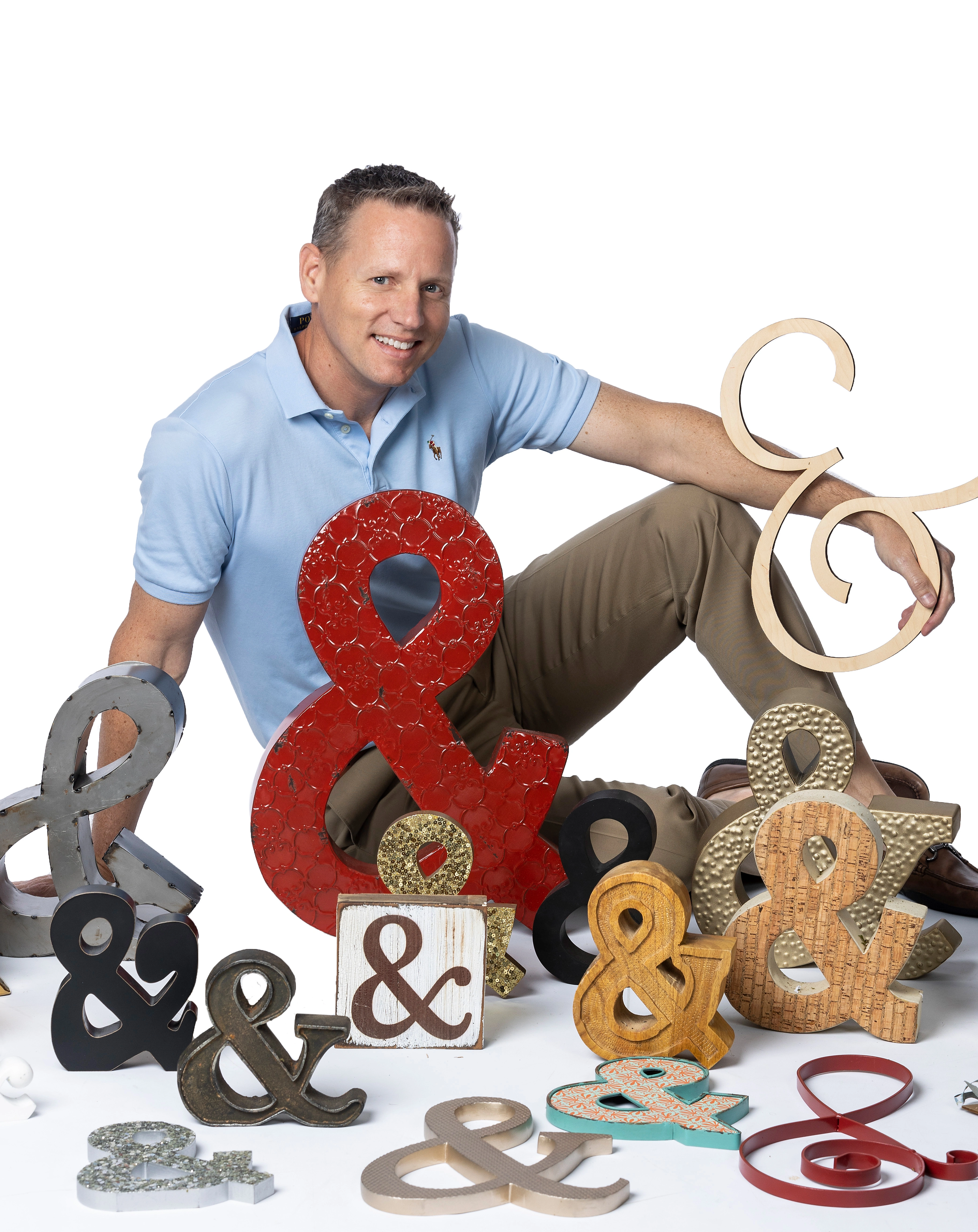 Chuck Norman with ampersand symbol branding