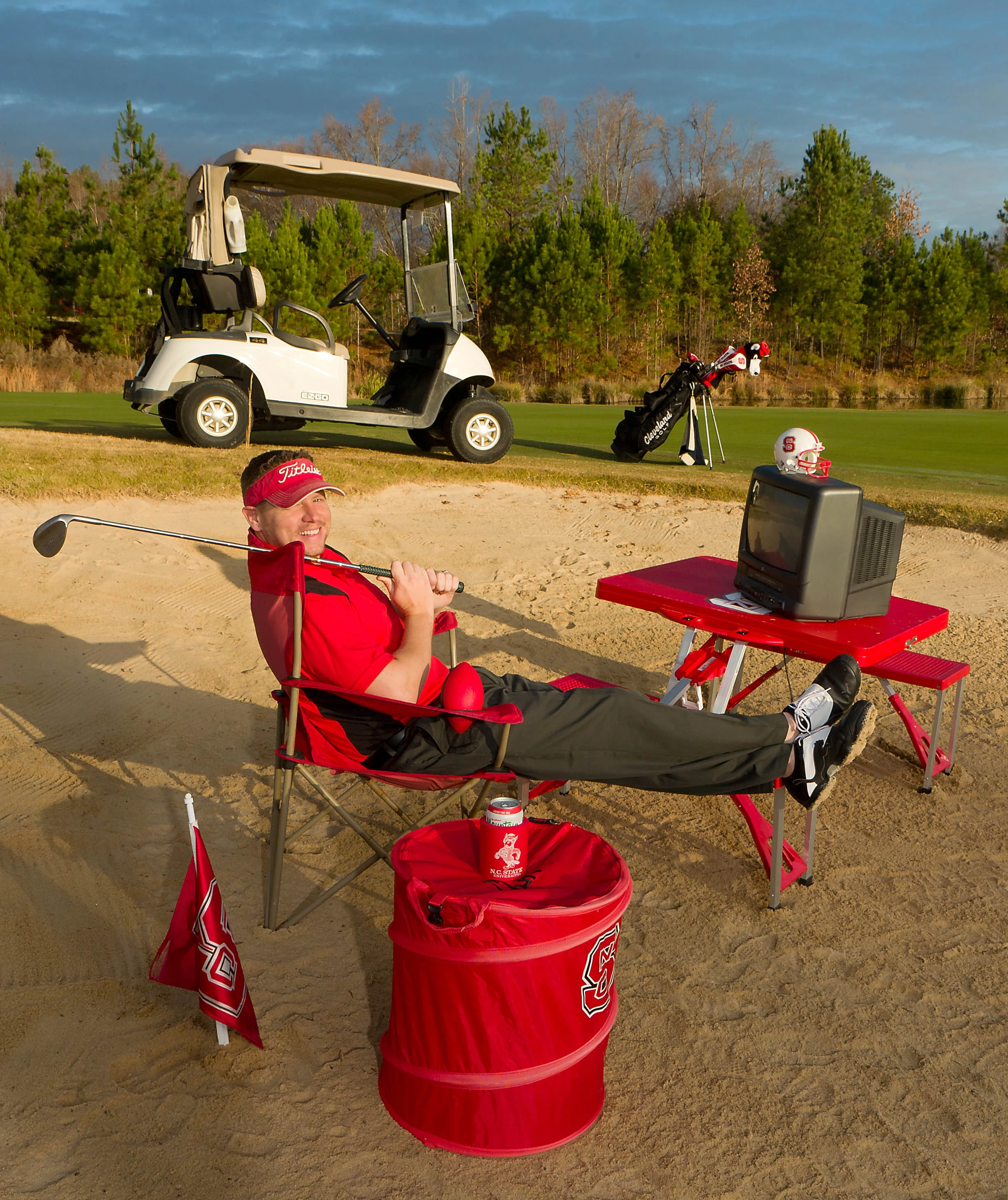 Chuck Norman in sand trap on golf course